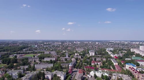 Aerial View of a Sports Arena on the Outskirts of the City and a River with a Network of Lakes on a