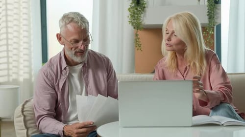 Happy Mature Modern Caucasian Couple Elderly Senior Female Woman Male Man Working Laptop Pc Smile