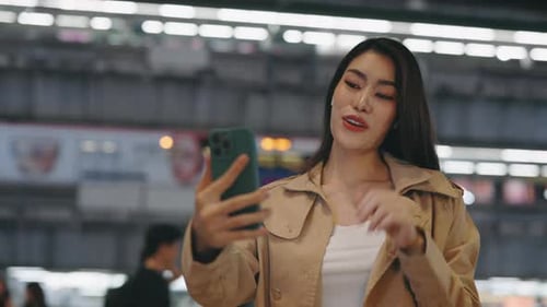 Beautiful Lady Tourist Making Video Call and Waving to Her Friends at Camera Standing on Street at