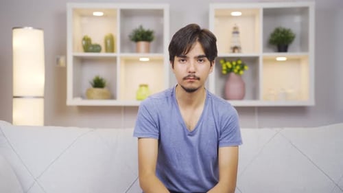 Fear reaction of man looking at camera. Coward man.
