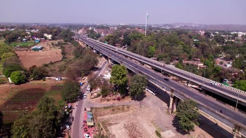 Tilwara Bridge with indian flag and trees at tilwara, jabalpur, madhya pradesh, india. day time, pus
