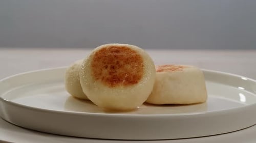 Delicious Steamed Buns Freshly Cooked and Beautifully Arranged on a Plate for Enjoyment