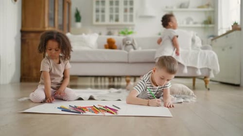 Kids Drawing Together on the Floor at Home