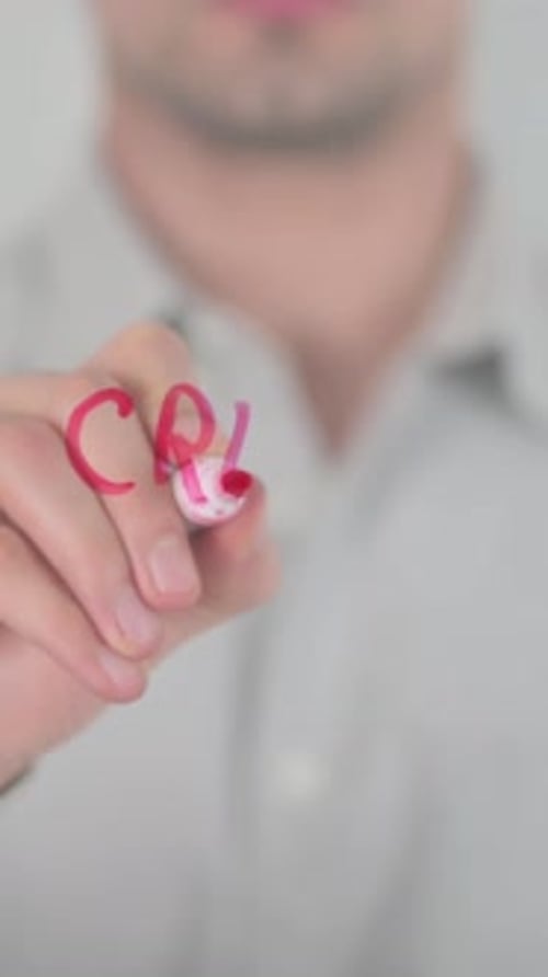 Writing Credit Report with Red Marker on Glass