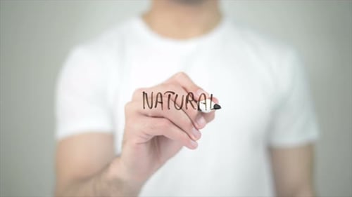 Writing the Word Natural with a Marker