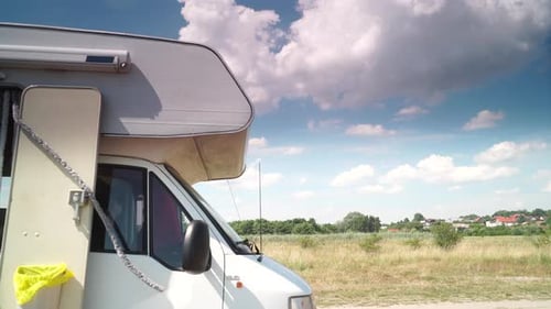 Recreational Vehicle in Field on Sunny Day