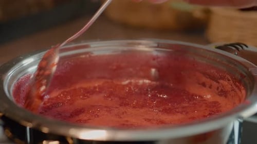 Berry Mixture Cooking in Silver Pot, Being Stirred