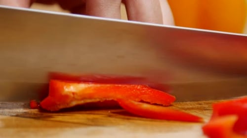 Slicing Red Pepper on a Cutting Board