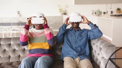 Couple Experiencing Virtual Reality at Home
