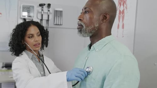 Doctor Examines Patient with Stethoscope in Clinic