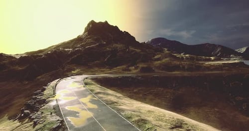 Curvas pitorescas de estradas montanhosas ao longo de um cenário dramático ao nascer do sol