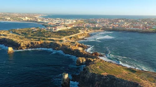 Drone Approach and Fly Over Peniche Town Cliffs and Sunset Portugal