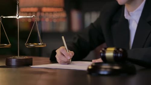 Close up of Judge Writing an Court Order