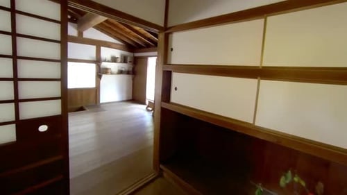 Steadicam shot moving through hall and into traditional Japanese kitchen.