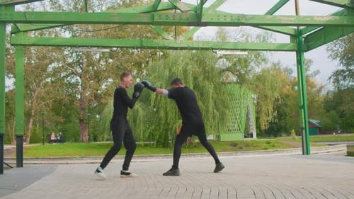 Boxing Training Outdoors Boxing Sparring Session Under Green Pergola Environment Two Individuals