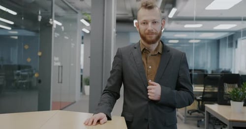 Slow Motion Portrait of Male Office Worker Standing in Coworking Place Wearing Trendy Suit
