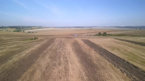 Tractor working on the field doing tillage with cultivator