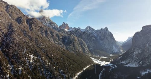 Aerial drone view of snow on the mountains in the Dolomites, Italy