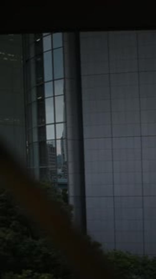 Tokyo Monorail Passing Through the City's Skyscapers in Vertical