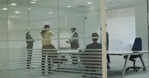 Office Workers Meeting in Modern Conference Room