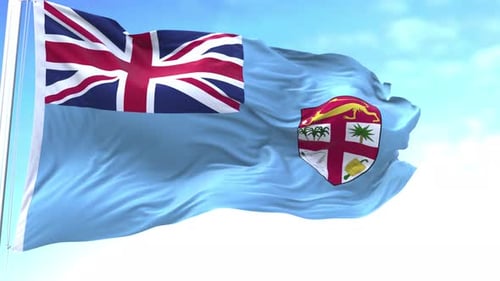 Realistic Fiji Flag Waving in the Wind against Blue Sky