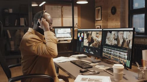 Male Editor Working on Footage in Program on Computer