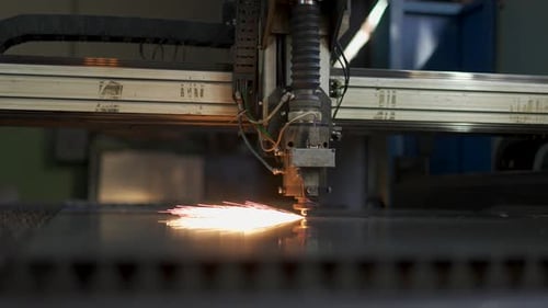 Industrial Machine Cutting Metal with Sparks