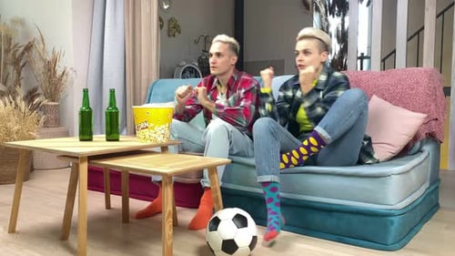 Young Adults Cheering at Soccer Game