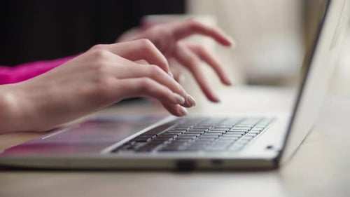 The Girl is Typing on the Keyboard of Her Laptop Remote Work From a Cafe Cropped View of Woman