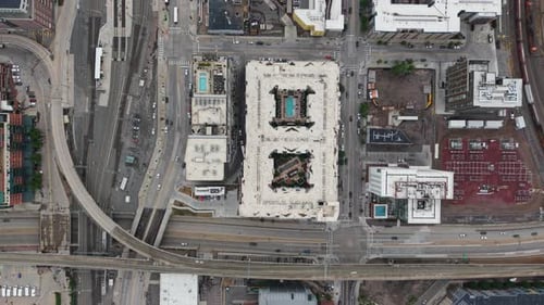 Top down drone shot over the Union station district of Denver city, cloudy day