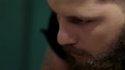 Man getting a haircut with clippers close up