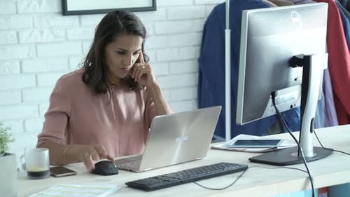 Elegant Woman Working Online in Modern Office
