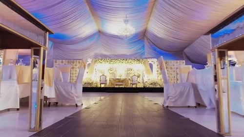 This gorgeous wedding hall set up. Picture a stunning dining table with matching chairs, all decked