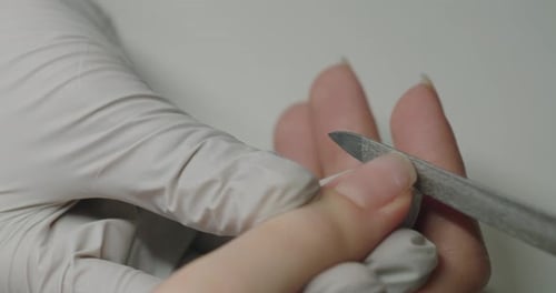 The Process of Nail Care in a Beauty Salon Nail File Processing
