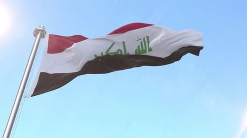 Die irakische Flagge weht im Himmel