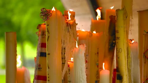 Wax Dripped Candles Burning with Bright Flames