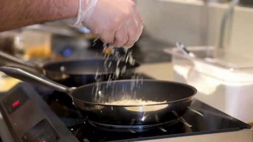 Slow motion view of adding tapioca flour to cook sandwich