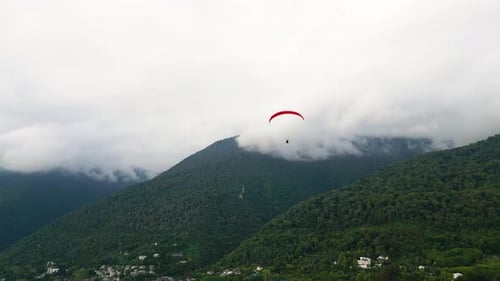 Paraglider Flying Over Mountains in Abkhazia Extreme and Active Rest Drone View
