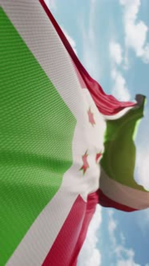 Realistic Burundi Flag Waving Against a Clear Blue Sky