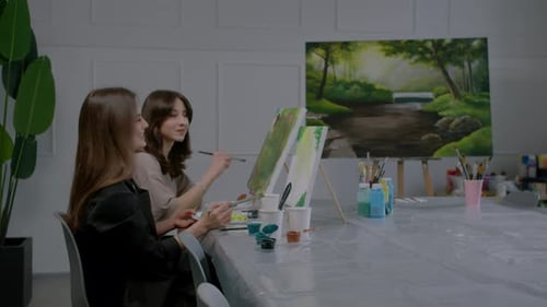 Two Women Painting a Picture Together