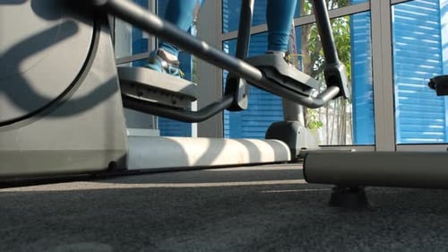 Closeup of Woman Workout on Elliptical Trainer