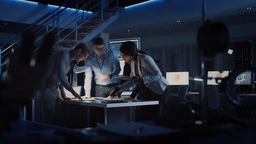 Team Meeting in Modern Blue Lit Tech Office