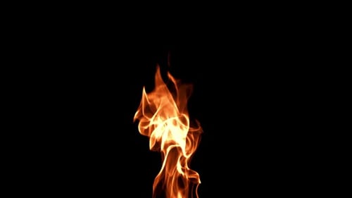 Golden Flame Burning Against Black Background