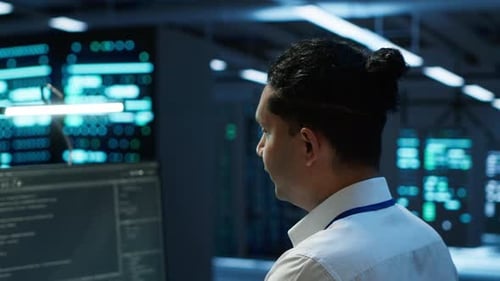 Portrait of Smiling Technician in Data Center Managing Infrastructure