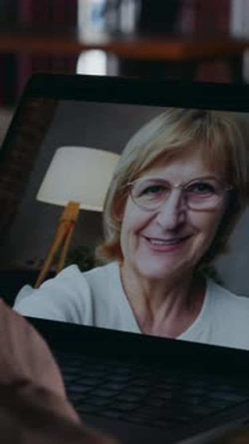 Woman Waving During Laptop Video Call, Close Up
