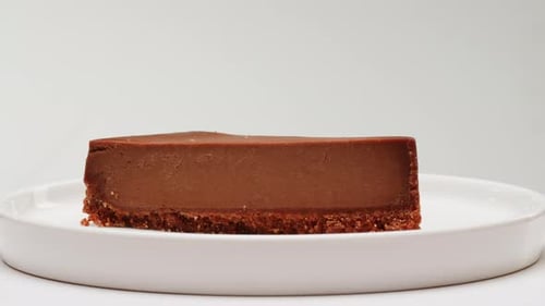 Chocolate Cheesecake Slice on White Plate