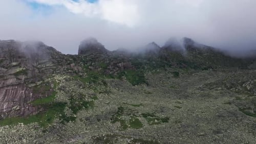 Clouds Embracing Mountain Peaks a Breathtaking Aerial View