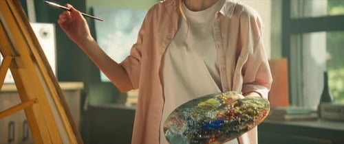 Artist Painting in Studio with Natural Sunlight