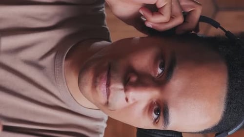 Young Adult Gaming with Intense Focus and Emotion