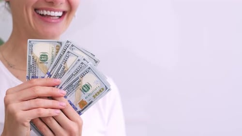 Excited Smiling Woman Showing Cash Money 1000 American Dollars Banknotes Hands with Money Close Up